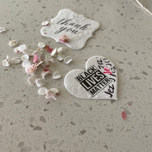 seed paper heart and tag with black lives matter messaage and confetti