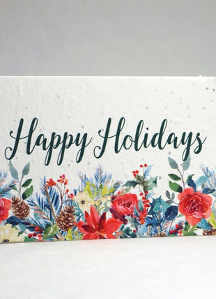 Greeting card with 'Happy Holidays' text and floral design on a white background