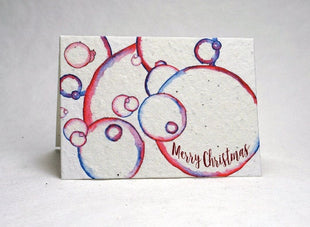 Christmas card with colorful bauble design and 'Merry Christmas' text on a white background
