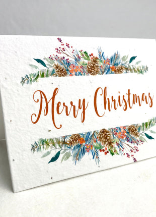 Christmas card with 'Merry Christmas' text and festive elements on a white background