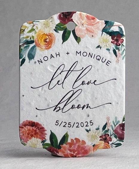 Floral design with text 'NOAH + MONIQUE let love bloom 5/25/2025' on a white background