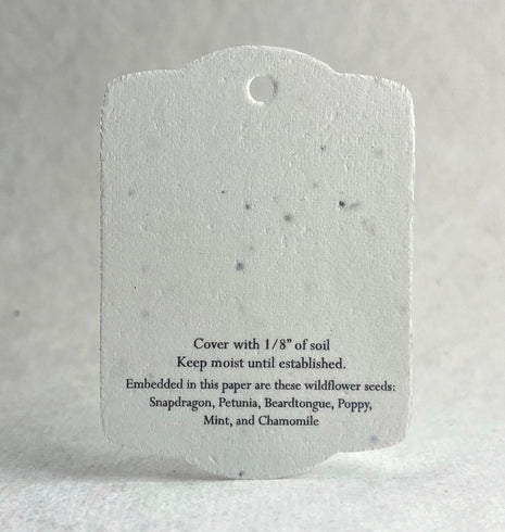 Seed paper tag with text on a gray background