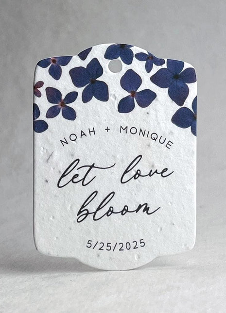 Seed paper heart with purple flowers and text on a white background