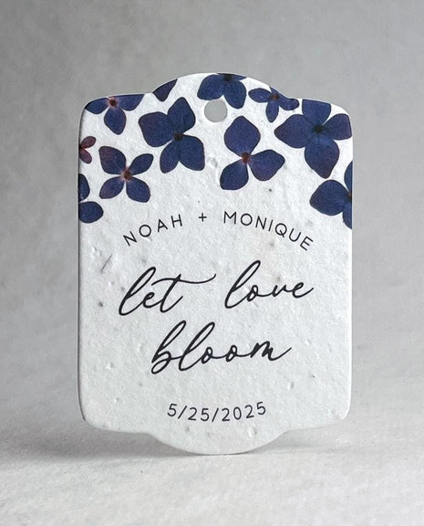 Seed paper heart with purple flowers and text on a white background