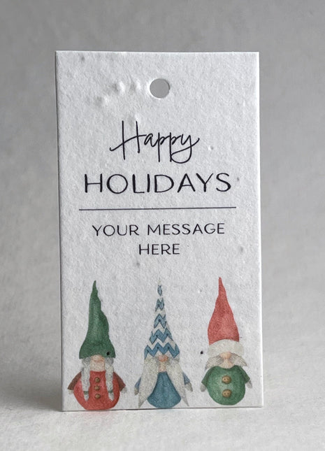 Happy Holidays tag with gnomes on a textured white background