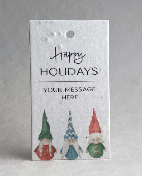 Happy Holidays tag with gnomes on a textured white background
