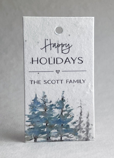 Holiday gift tag with 'Happy Holidays' and 'The Scott Family' text, featuring a winter landscape design.