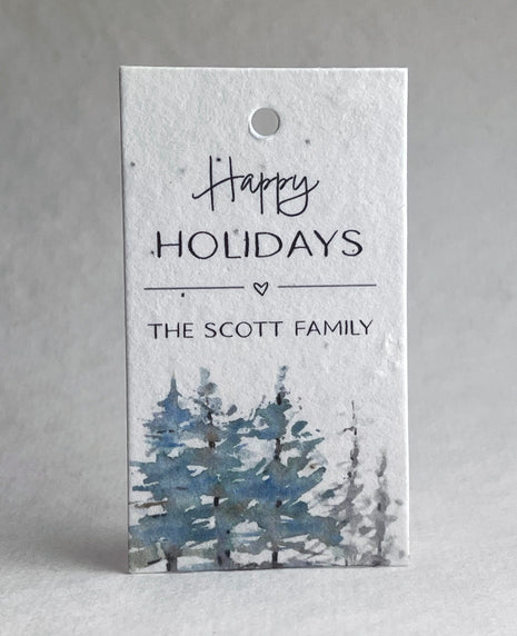 Holiday gift tag with 'Happy Holidays' and 'The Scott Family' text, featuring a winter landscape design.