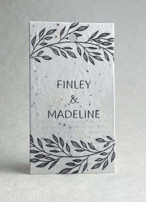 Card with 'FINLEY & MADELINE' text and leaf designs on a white background