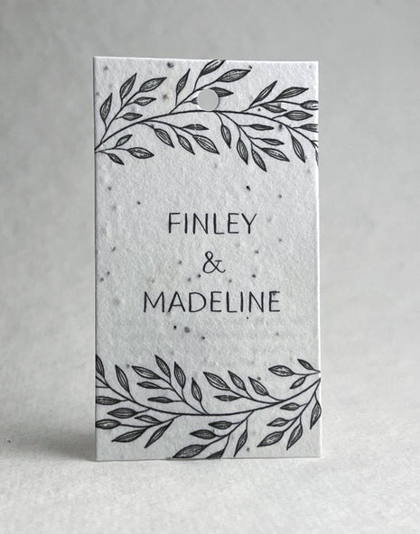 Card with 'FINLEY & MADELINE' text and leaf designs on a white background